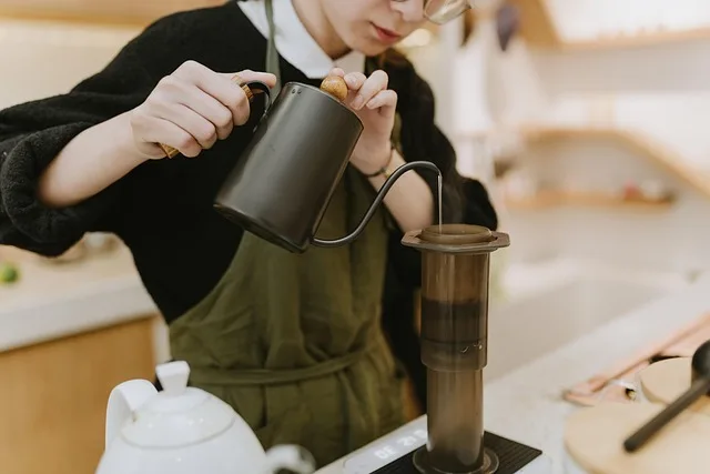 Barista pouring coffee